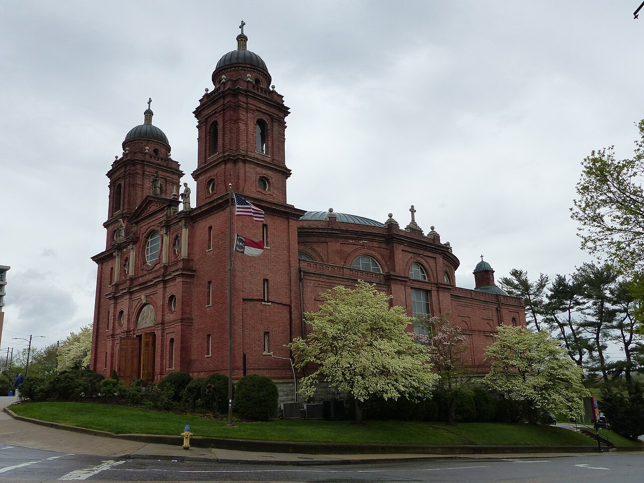 The brick Basilica of St. Lawrence and its twin towers in Asheville.