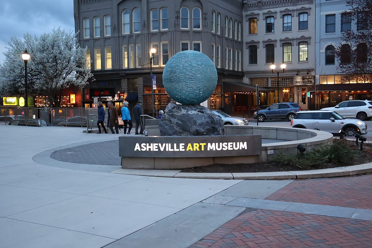 The Asheville Art Museum on Pack Square, with a globe sculpture in front.