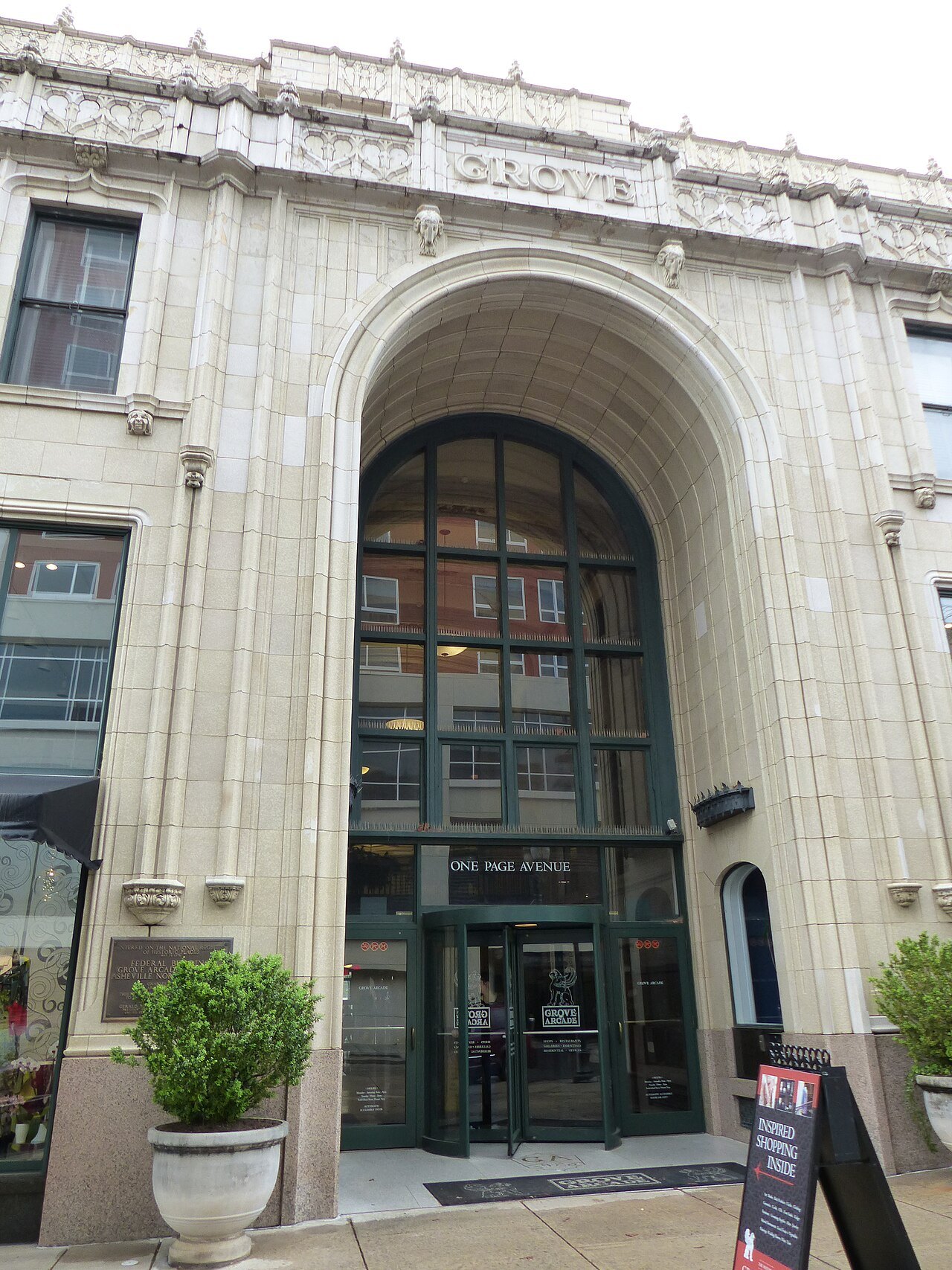 The arched stone entrance of the Grove Arcade in Asheville.