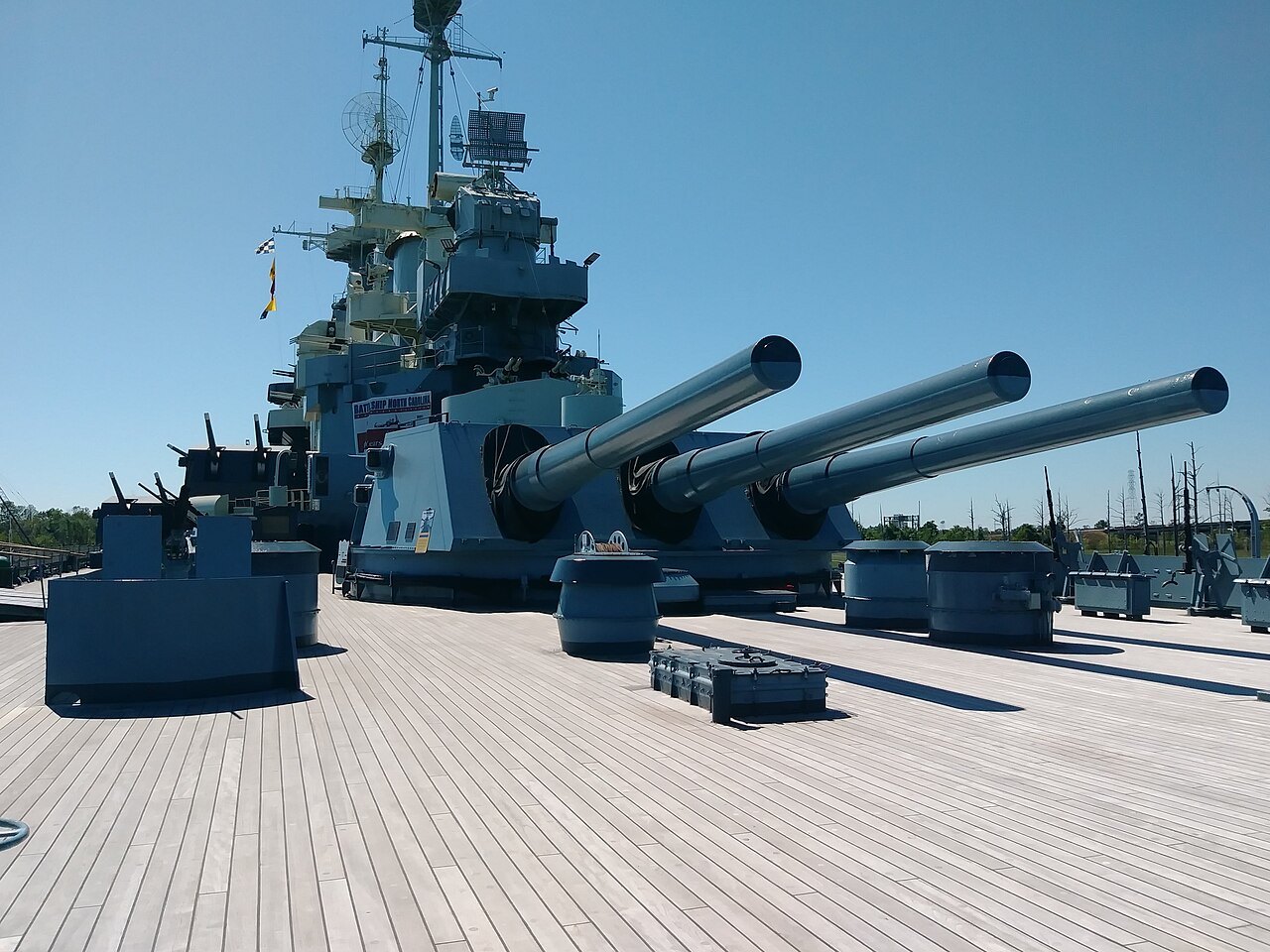 The big guns of a forward turret on the deck of the Battleship North Carolina.