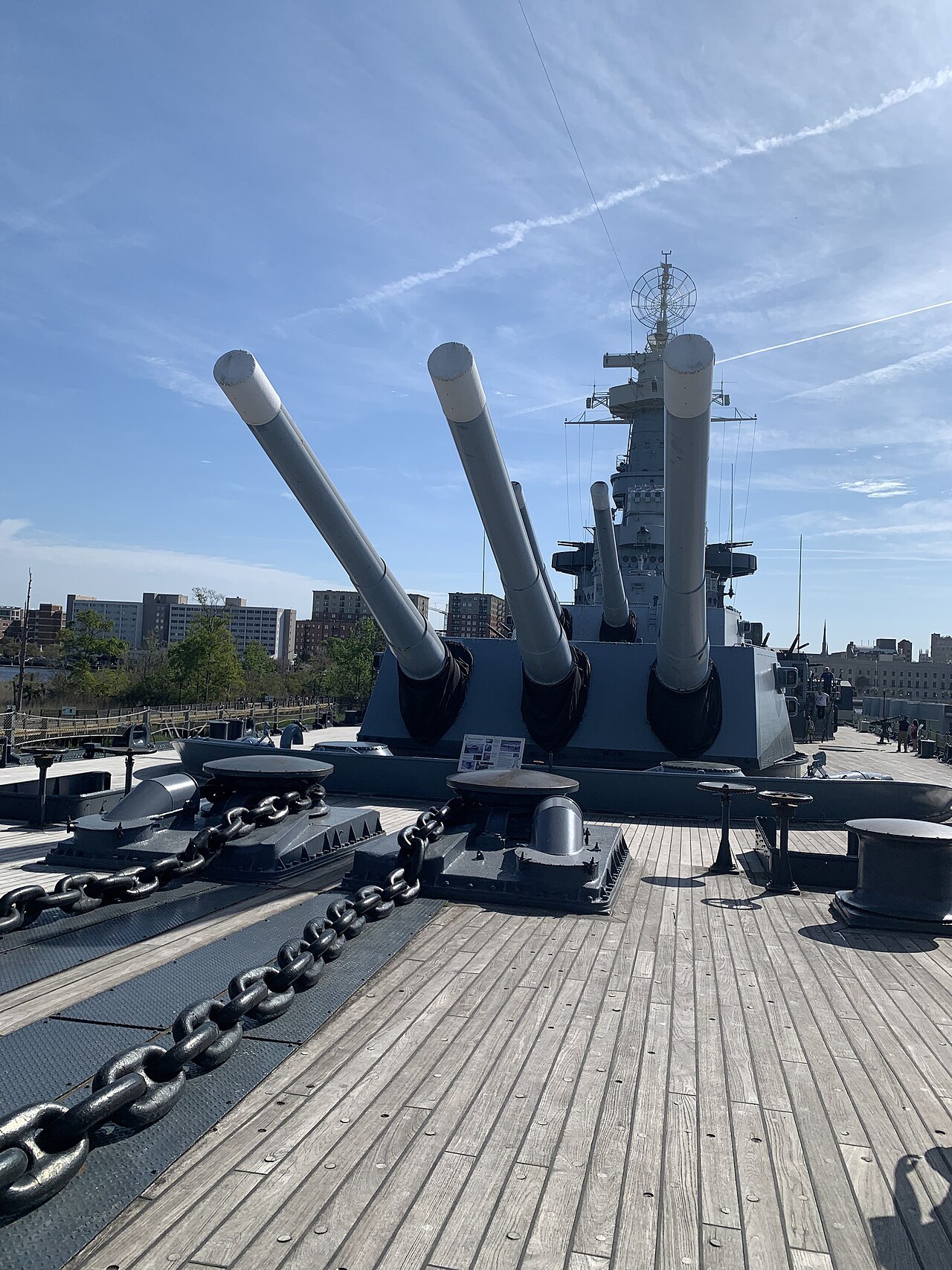 The chain-covered forecastle and forward turrets of the battleship.