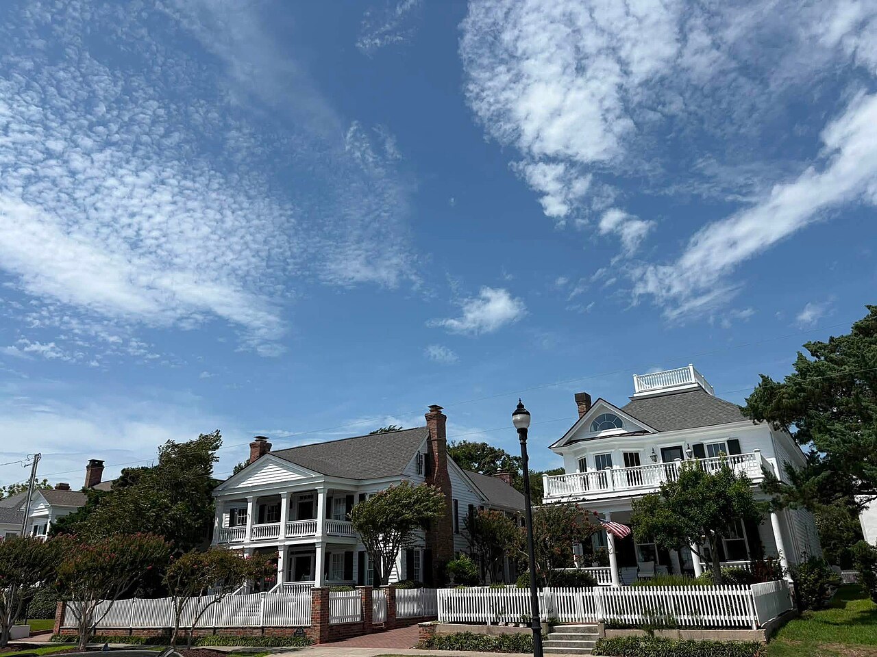 Front Street mansions with double porches and picket fences in Beaufort.
