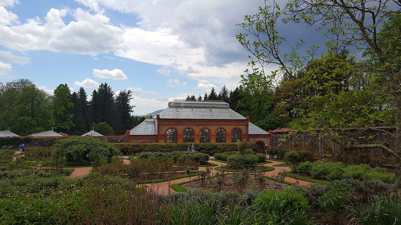 The glass conservatory beyond the walled garden at Biltmore.