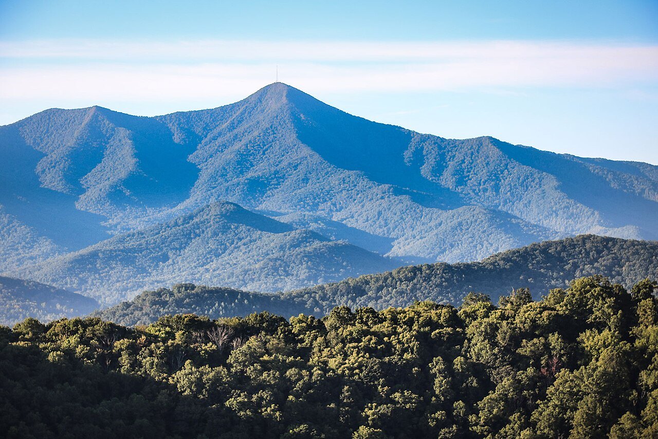 Mount Pisgah rising above the forested ridges in summer.