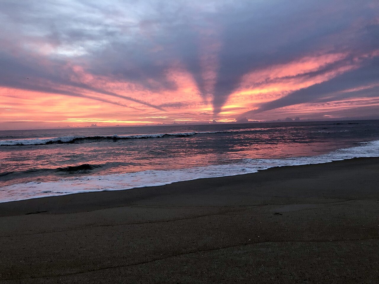 A red sunrise over the surf on the Outer Banks.
