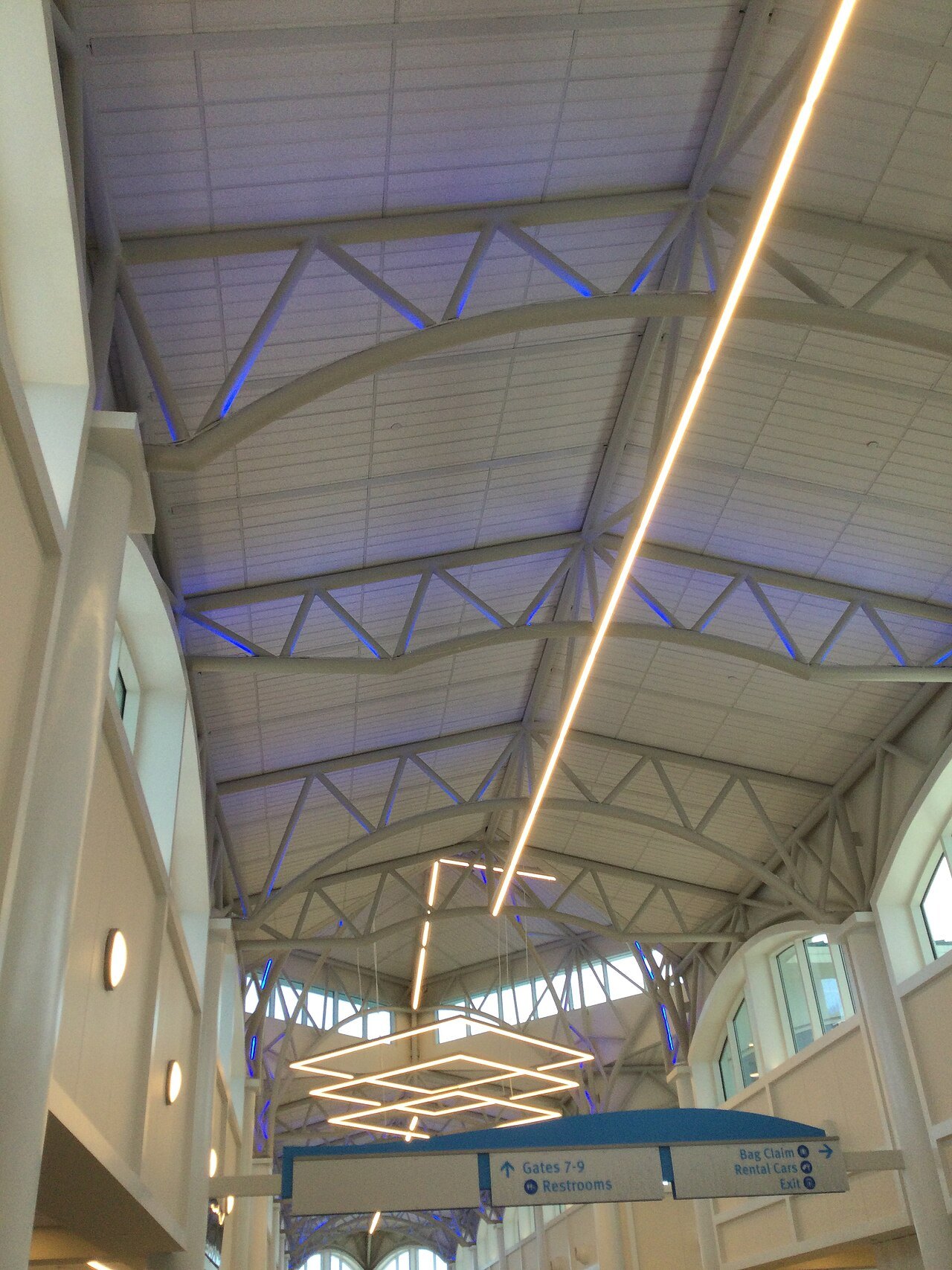 The lit roof trusses of the terminal at Wilmington International Airport.
