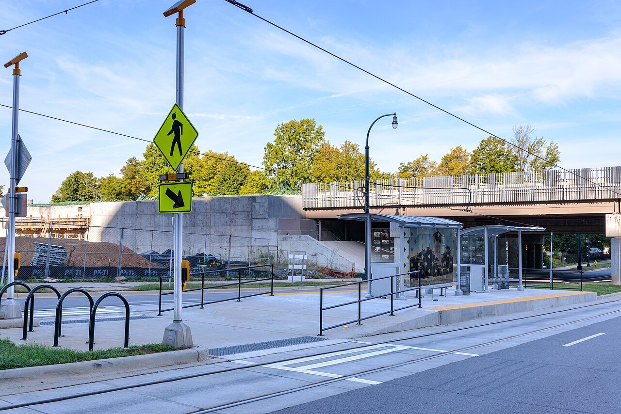 A light-rail stop and footbridge at Charlotte Gateway Station.