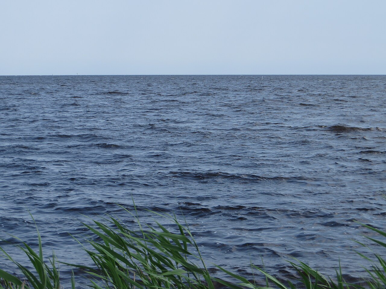 Grey water of Pamlico Sound beside US 264 at Stumpy Point.