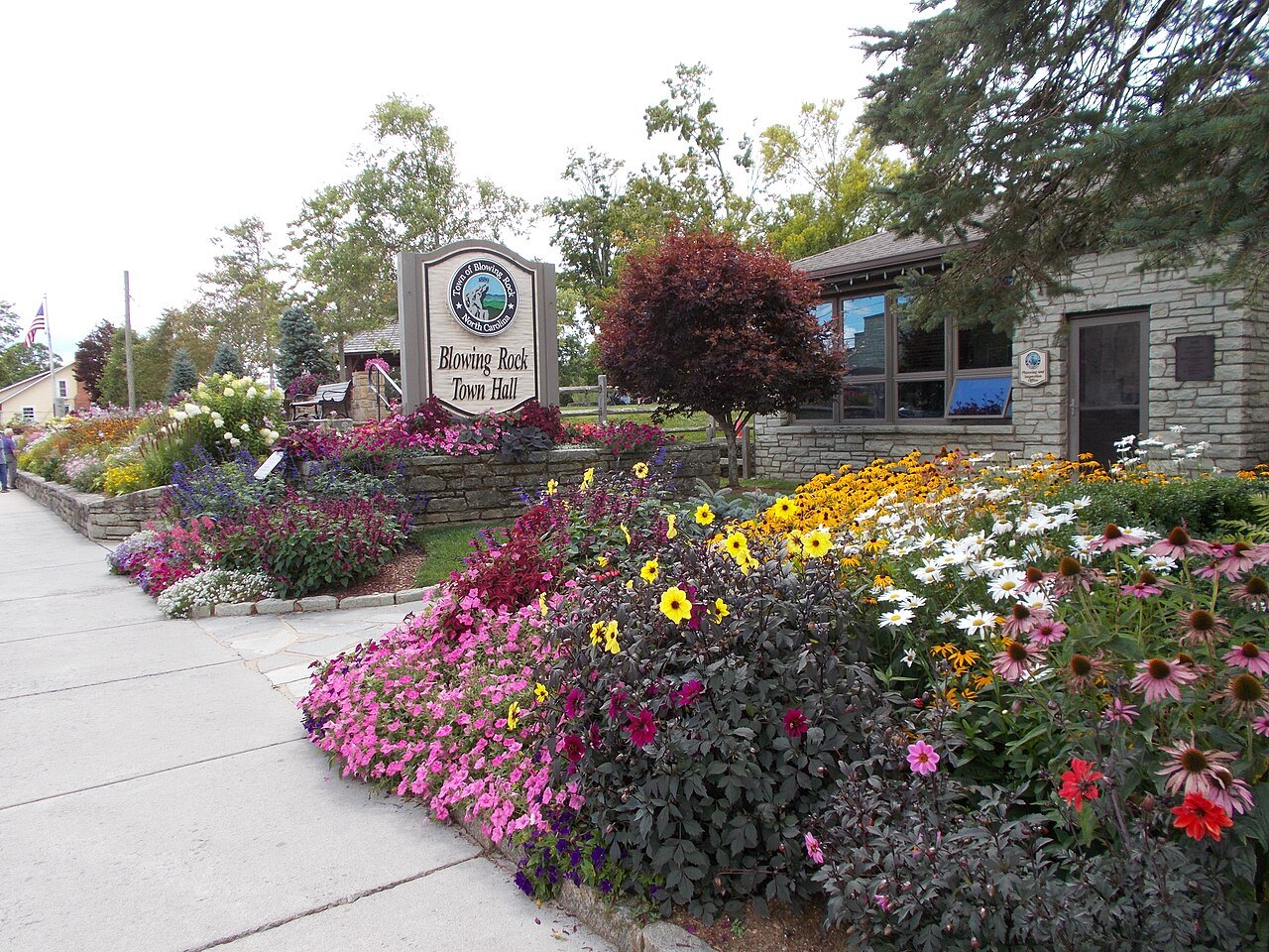 Flower beds in bloom in front of Blowing Rock Town Hall.