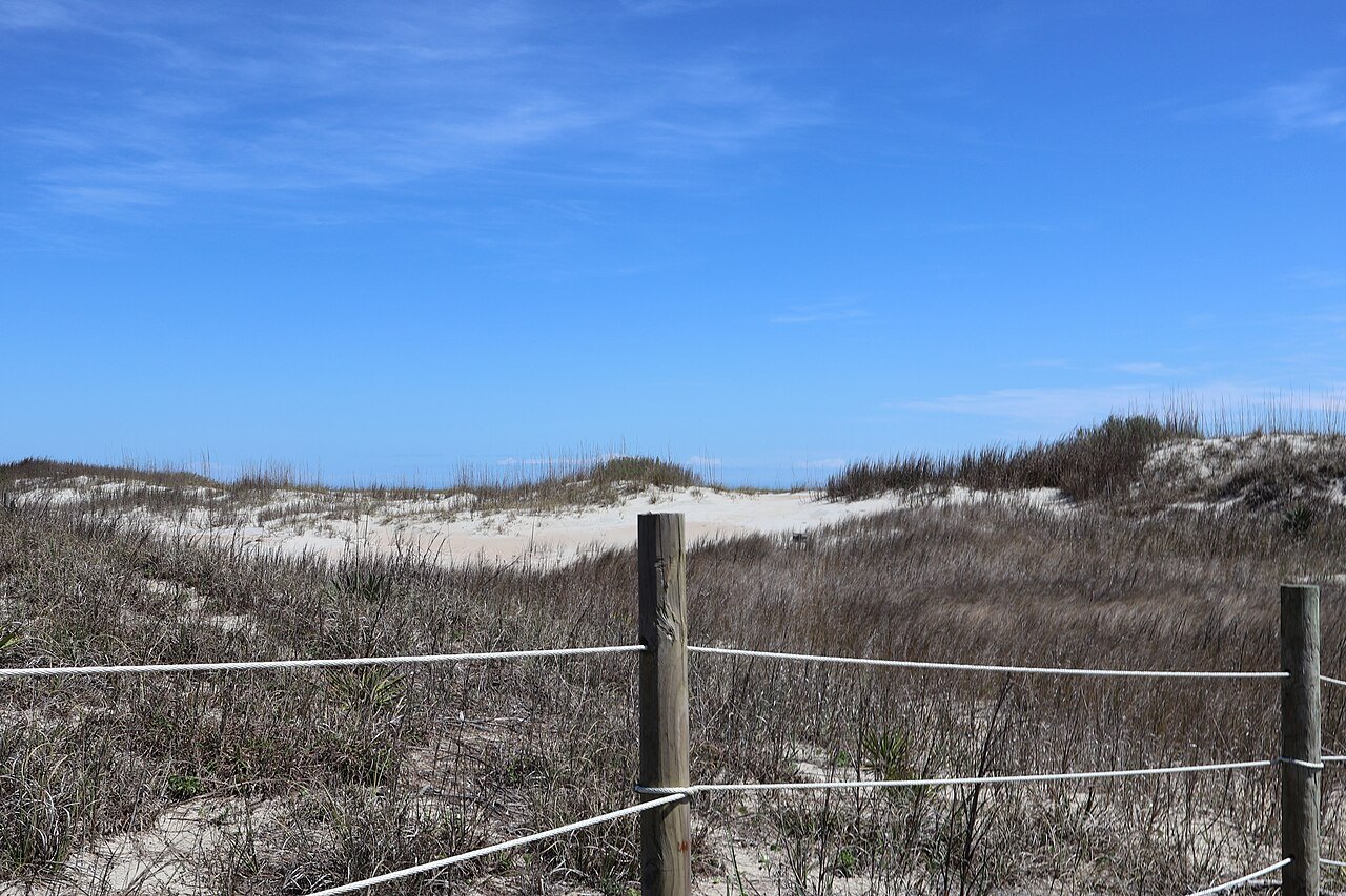 Dunes and beach grass behind a rope fence at Emerald Isle.