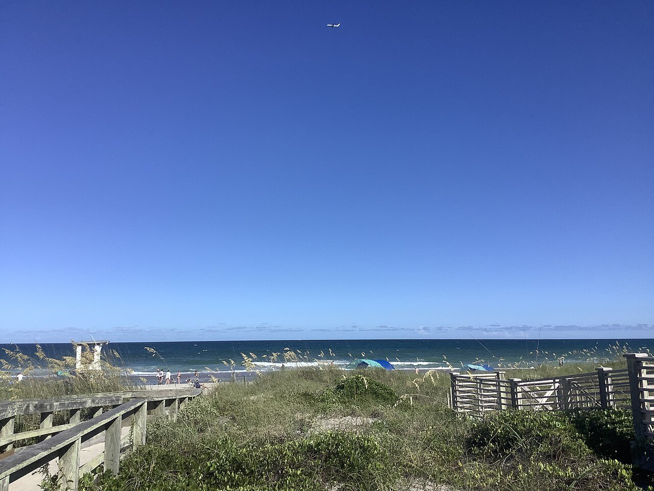 Dune grass and a boardwalk above the sea at Wrightsville Beach.