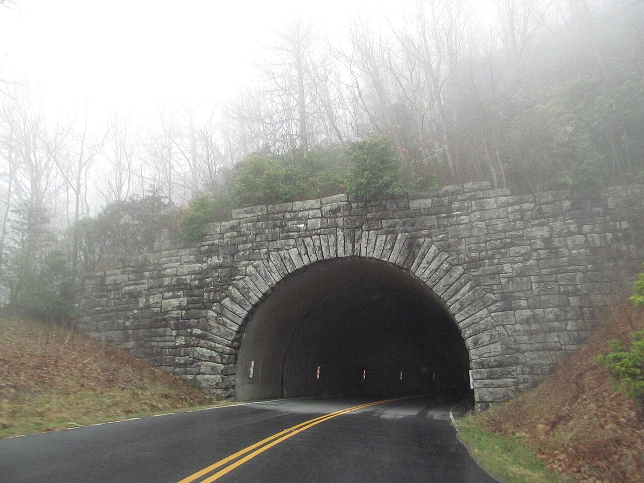 A stone-faced Parkway tunnel in the mist.