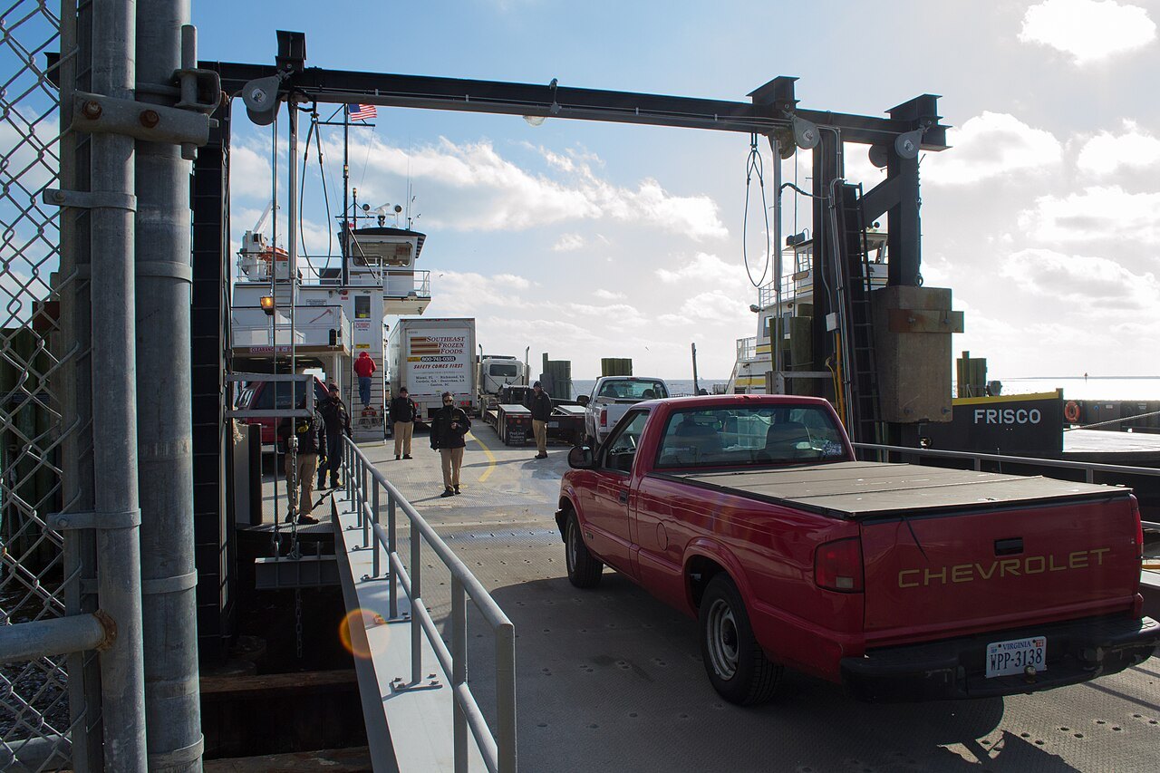A pickup driving aboard a ferry at Stumpy Point.