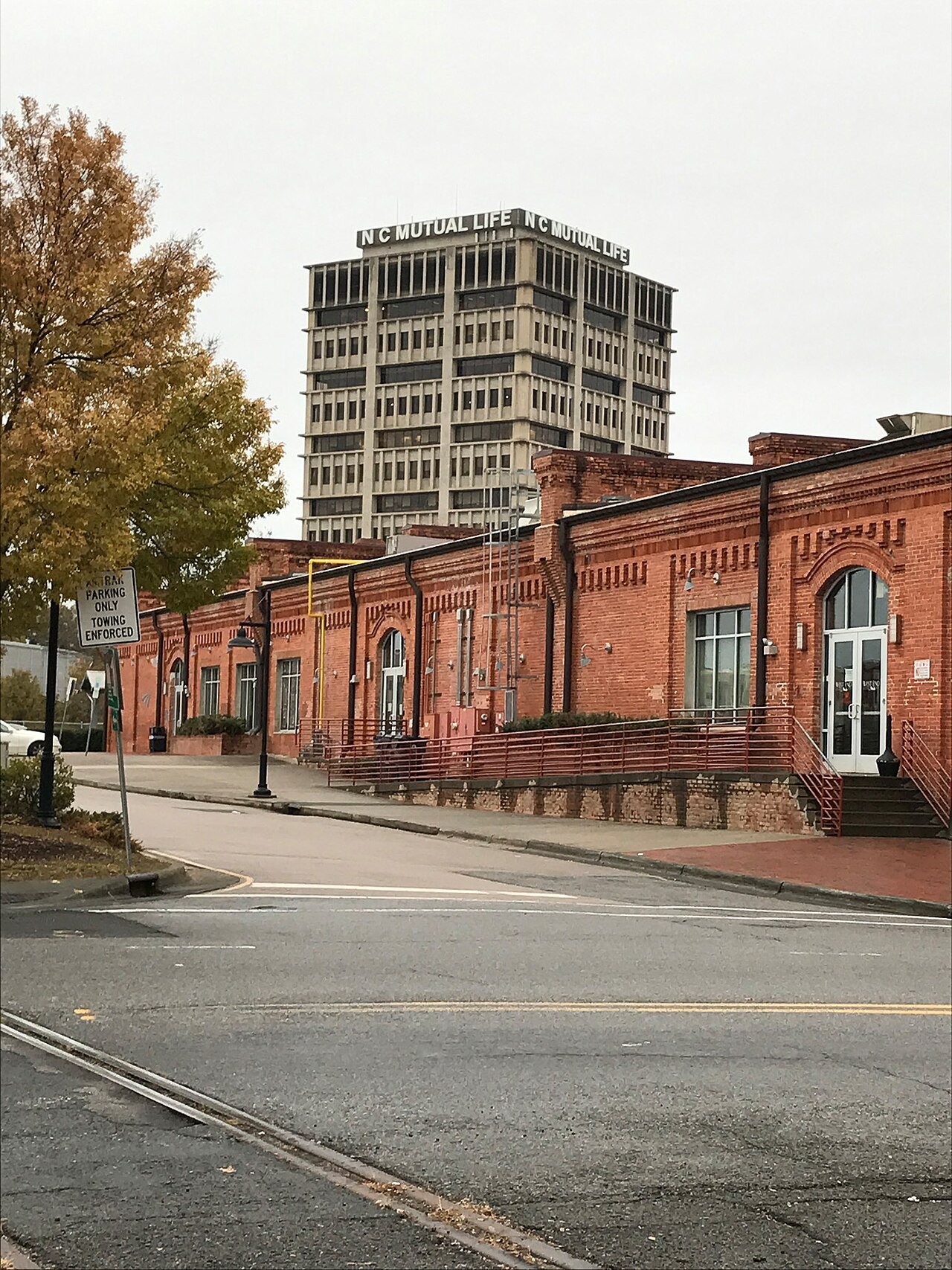 The brick North Carolina Mutual Life building below a tower in Durham.