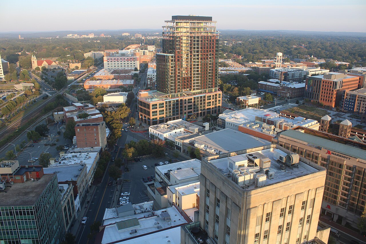 Downtown Durham's rooftops and towers seen from above.