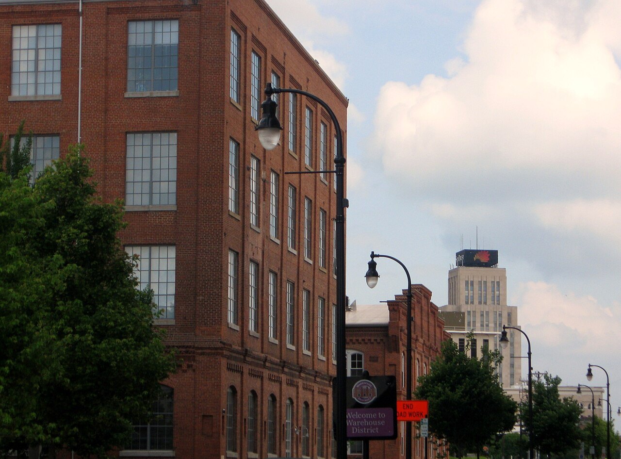 A red-brick warehouse and a lamp post in Durham's old tobacco district.