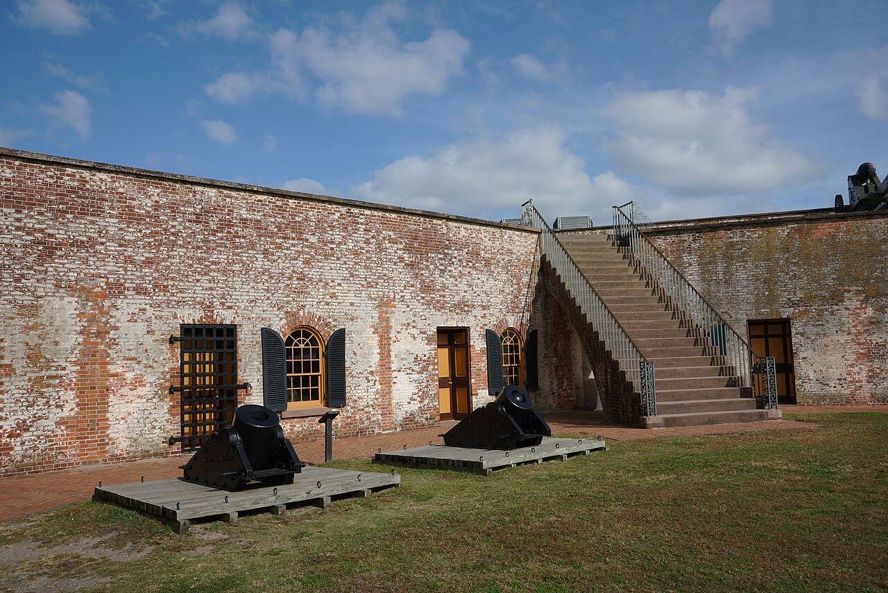 Cannon in front of the casemates and stair inside Fort Macon.