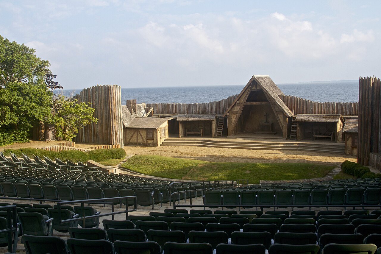 The seats and stage of the Waterside Theatre, with Roanoke Sound behind.