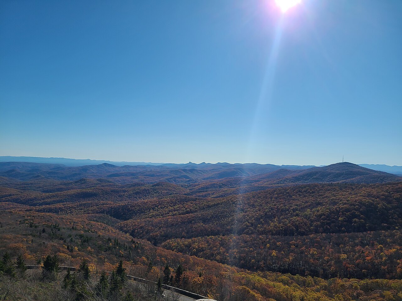 Sun over autumn ridges seen from Rough Ridge on Grandfather Mountain.