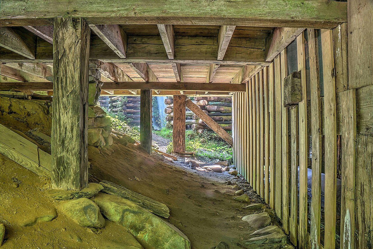 The wooden flume and machinery under Mingus Mill.