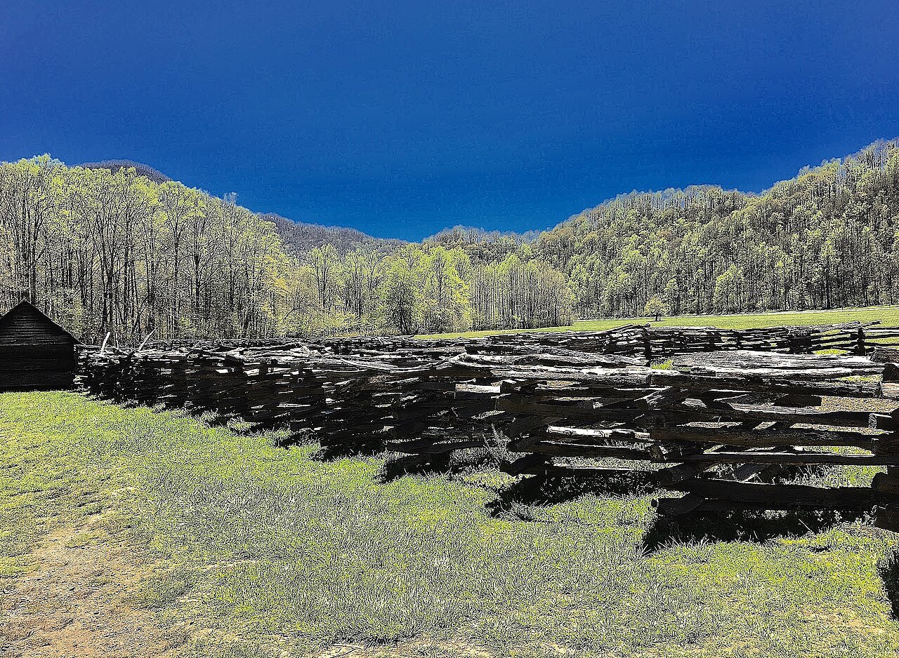Split-rail fences across a mountain meadow at the Oconaluftee farm.