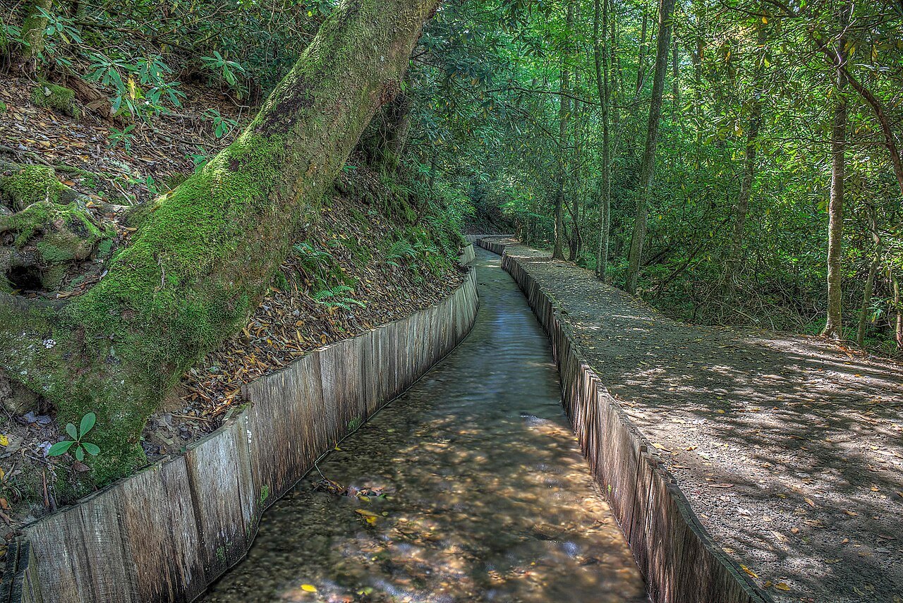 The long wooden flume carrying water through the woods to Mingus Mill.