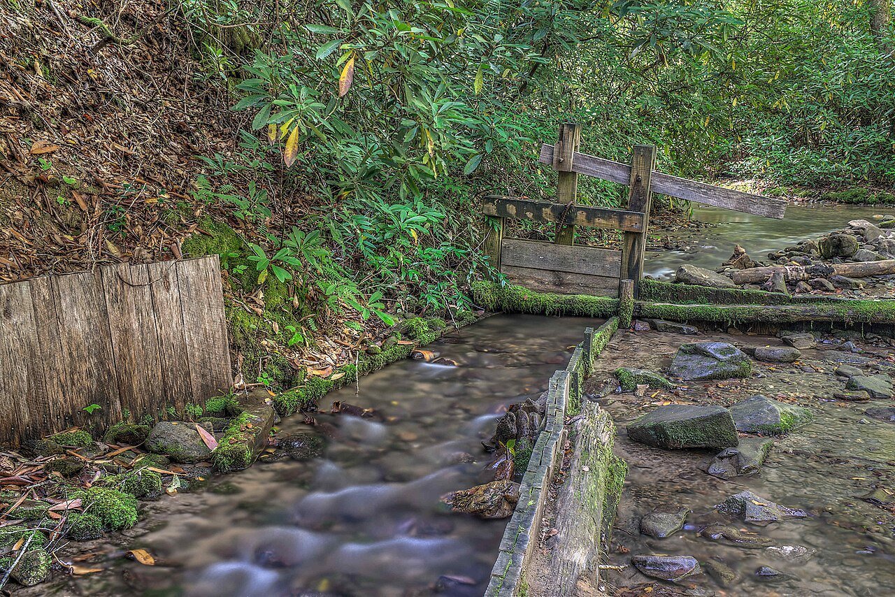 A mill race of wooden boards beside the Mingus Mill trail.