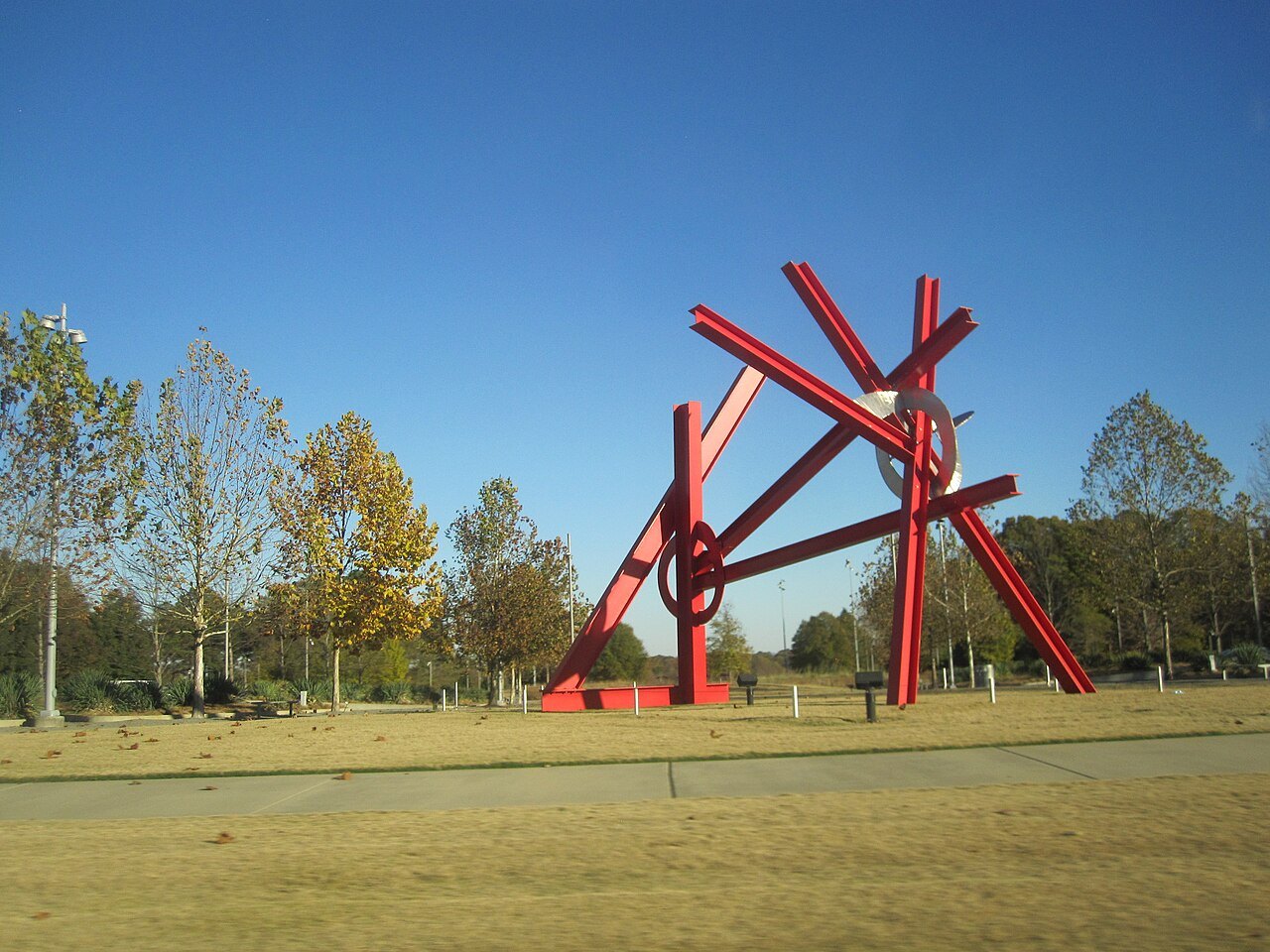 A giant red steel sculpture in the park of the North Carolina Museum of Art.