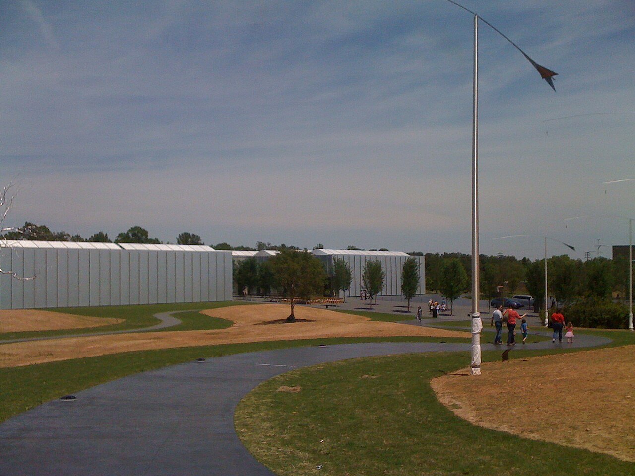 The long, low West Building of the Museum of Art beyond its lawn and paths.