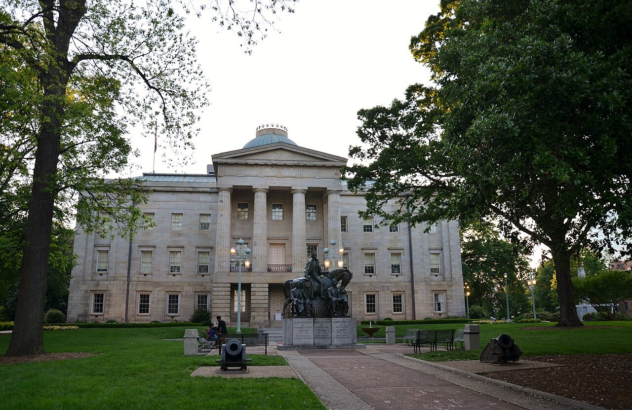 The North Carolina State Capitol at the end of its walk, with the Three Presidents statue.