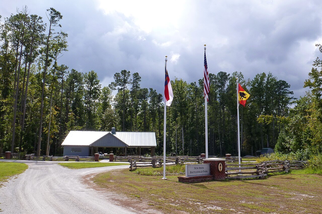 Flags and the visitor building at the New Bern Battlefield site.