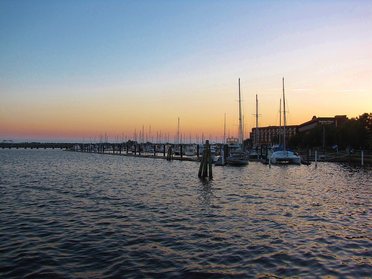 Sailboat masts at the marina in New Bern at sunset.