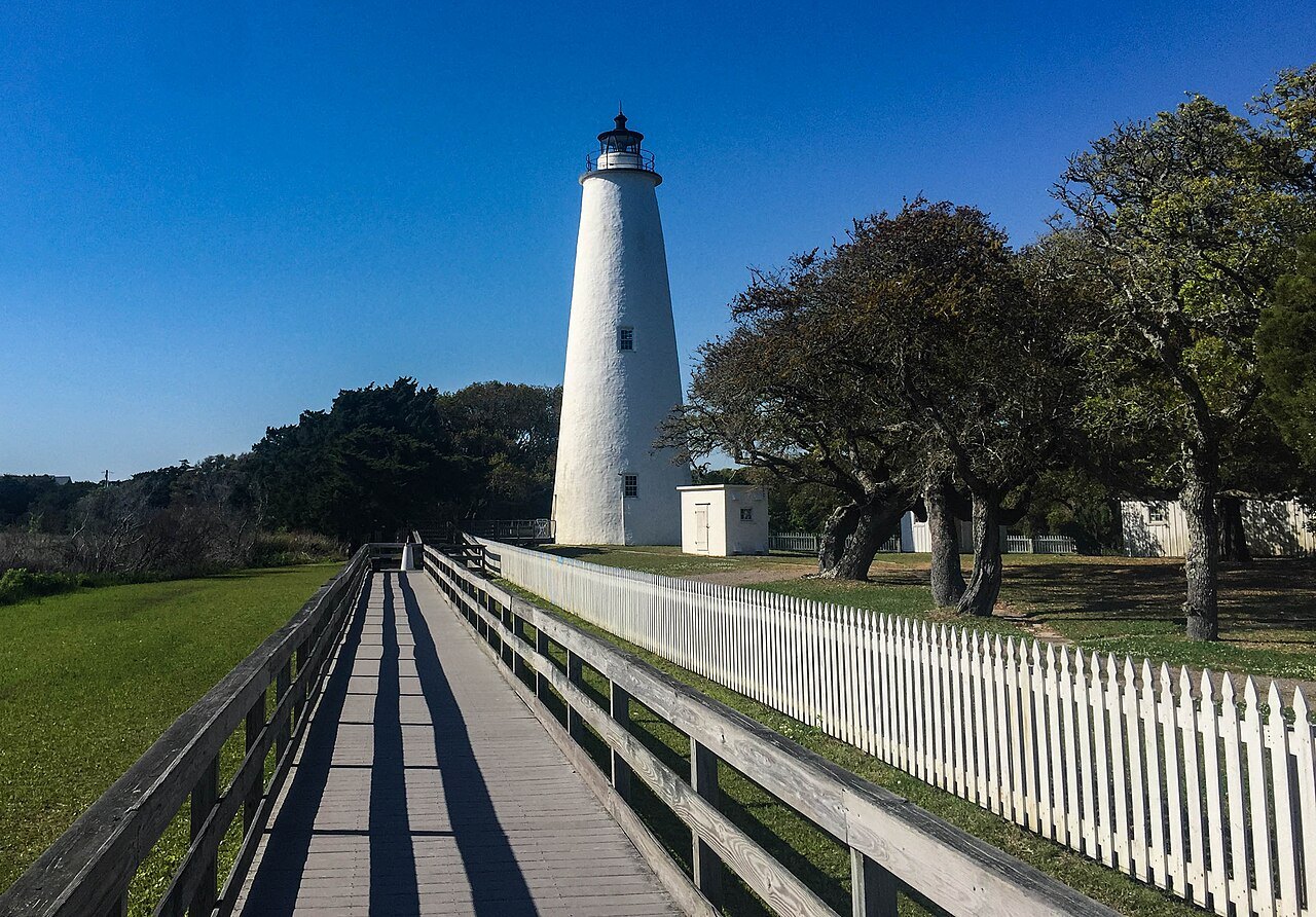 The Ocracoke Light at the end of its boardwalk and picket fence.