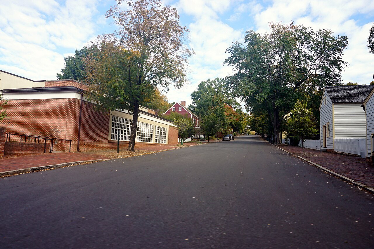 A quiet street of brick and clapboard houses in Old Salem in October.