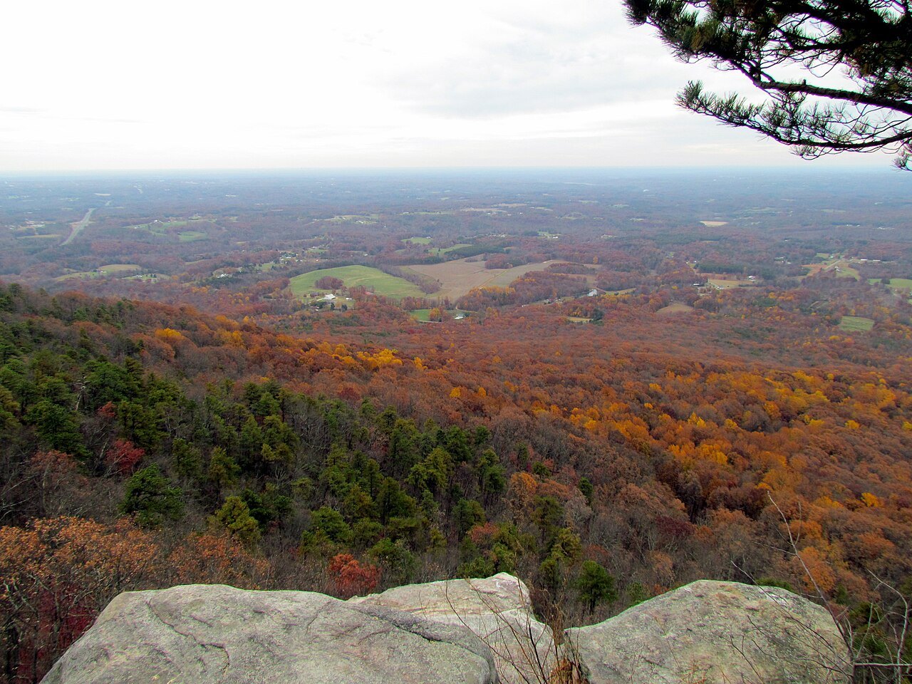 Autumn color across the Piedmont below Pilot Mountain.