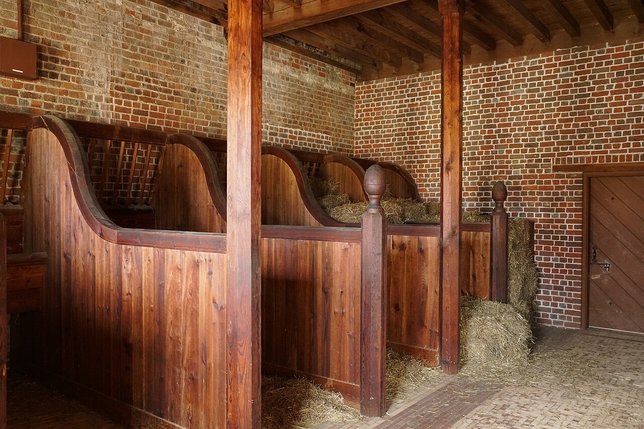 Wooden horse stalls in the stable wing of Tryon Palace.