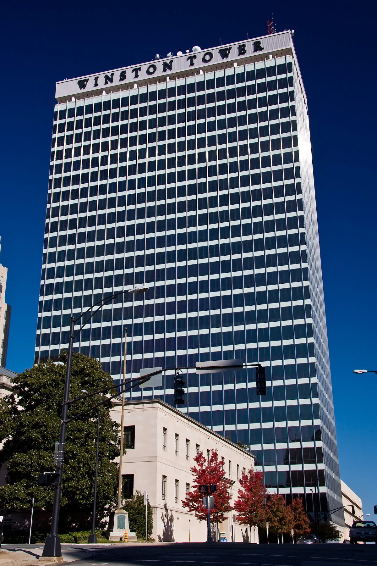 Winston Tower, the old Wachovia building, against a deep blue sky.