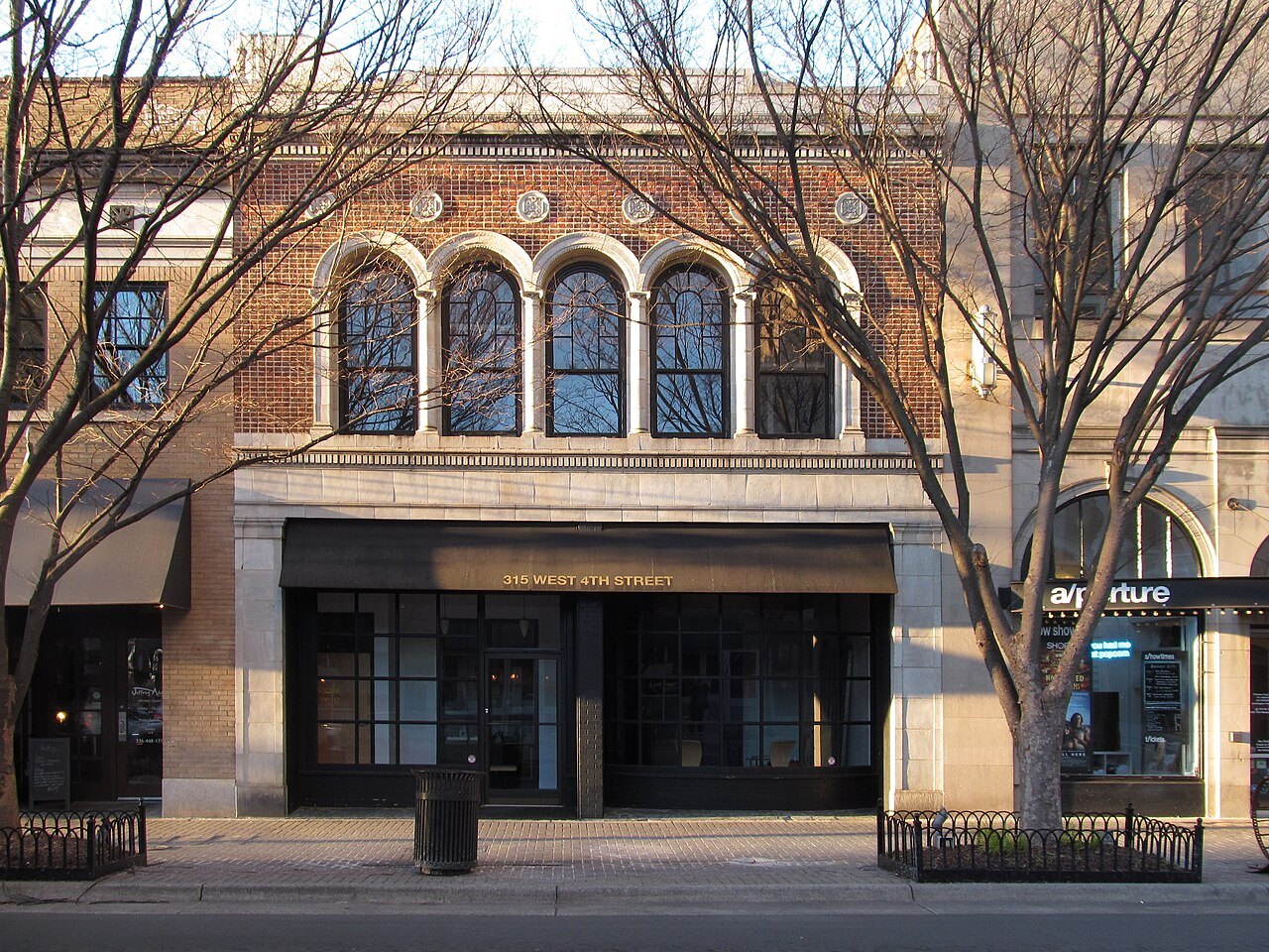 Arched windows above a shop front on West Fourth Street in Winston-Salem.