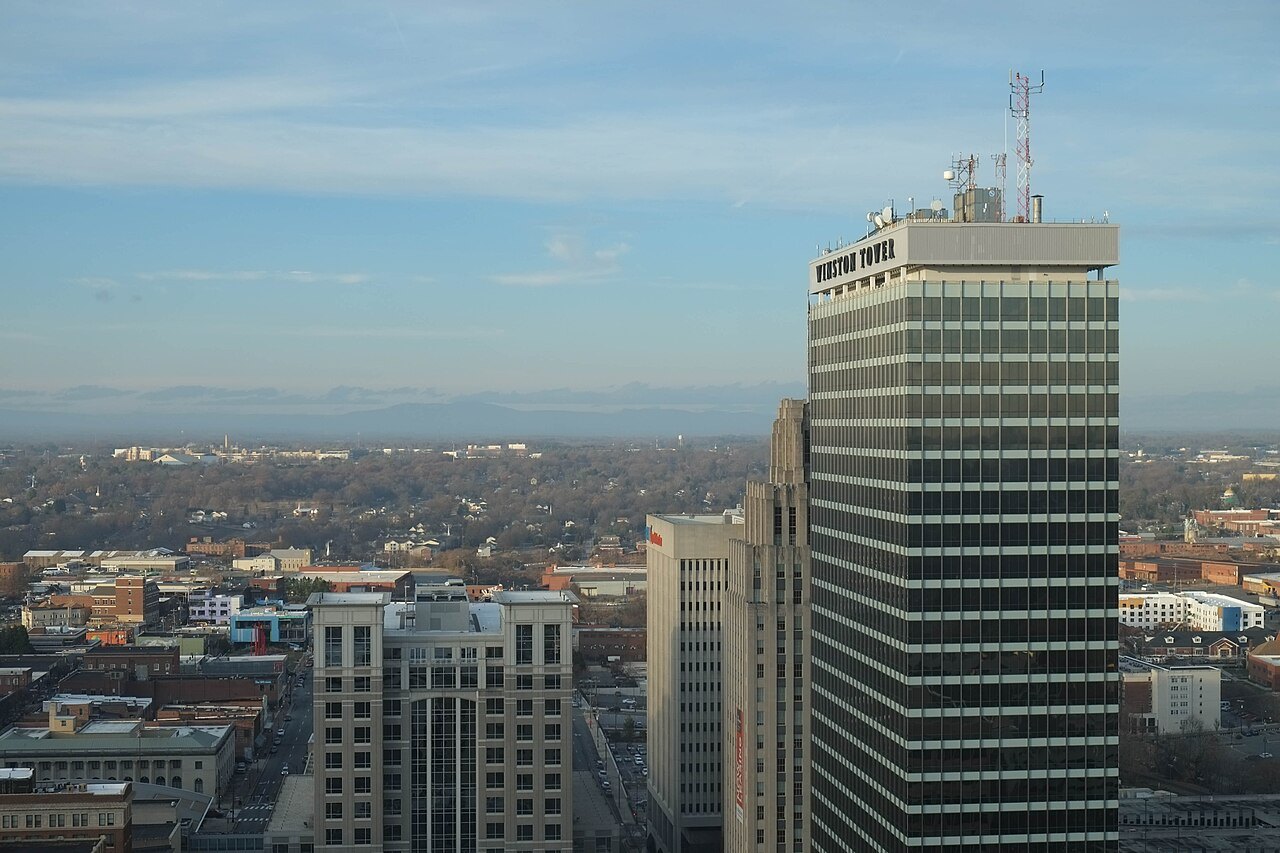 Winston Tower above downtown Winston-Salem, with the mountains on the horizon.