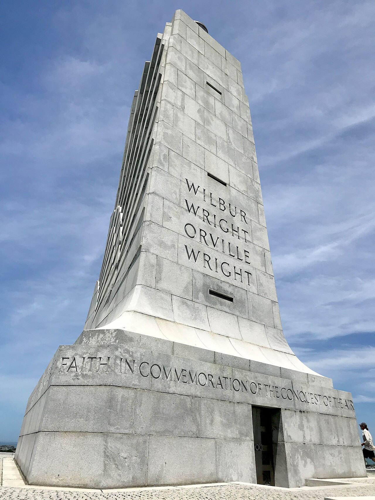 The Wright Brothers Memorial and the inscription around its base.