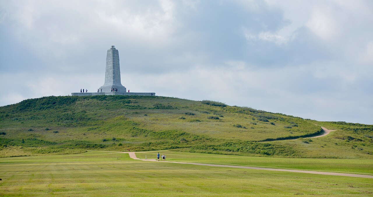 The memorial on Kill Devil Hill above the grassy field.